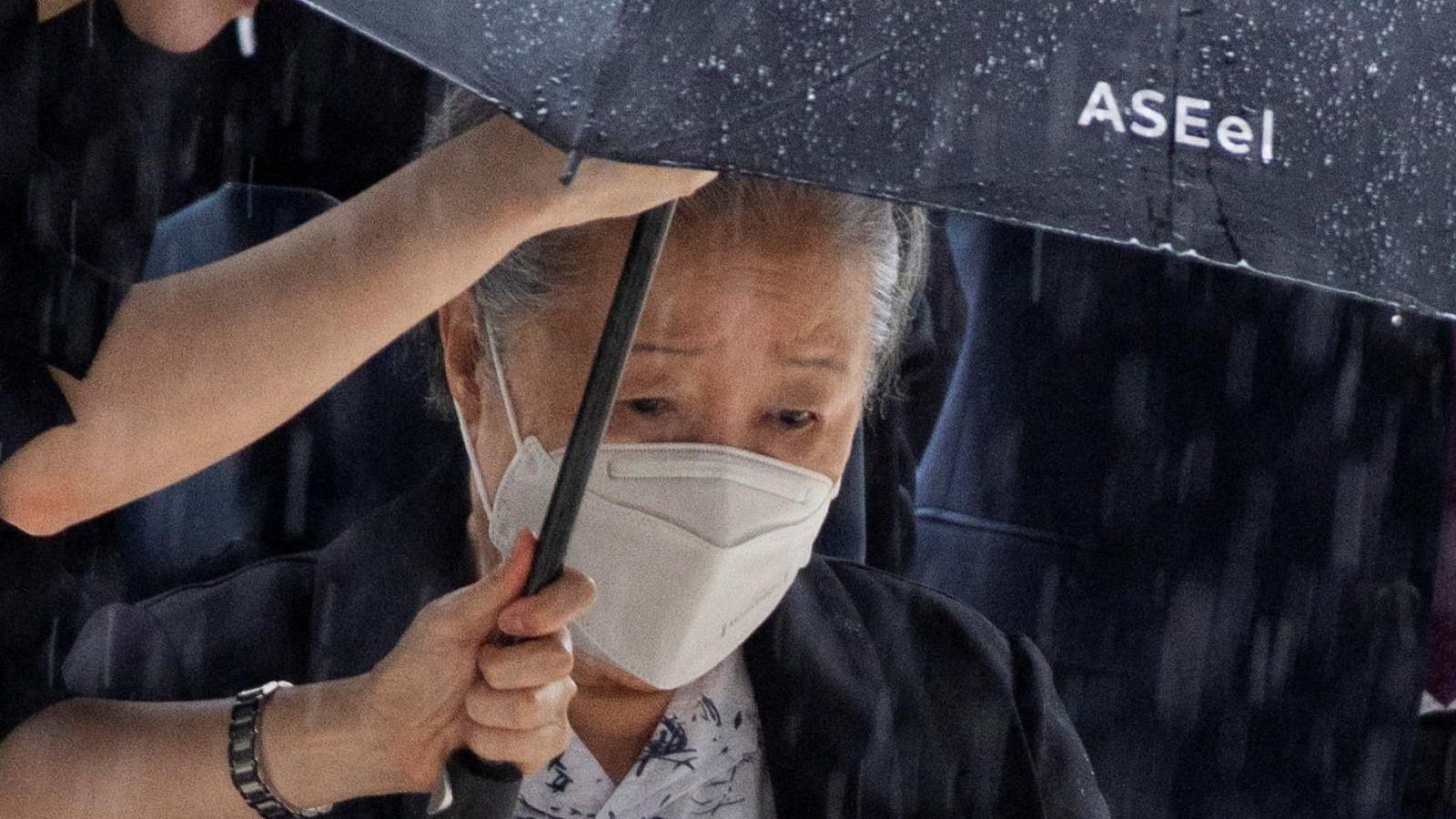 Han Hak-ja arriving at a Seoul court for her sentencing hearing